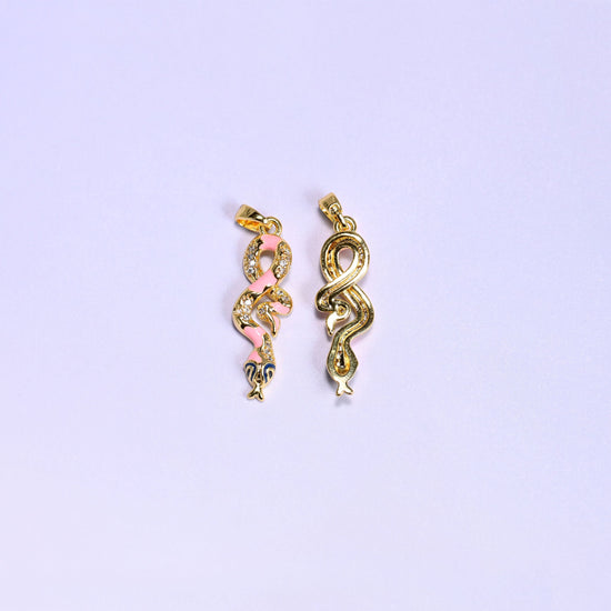 Coiled snake charm with a navy enamel head