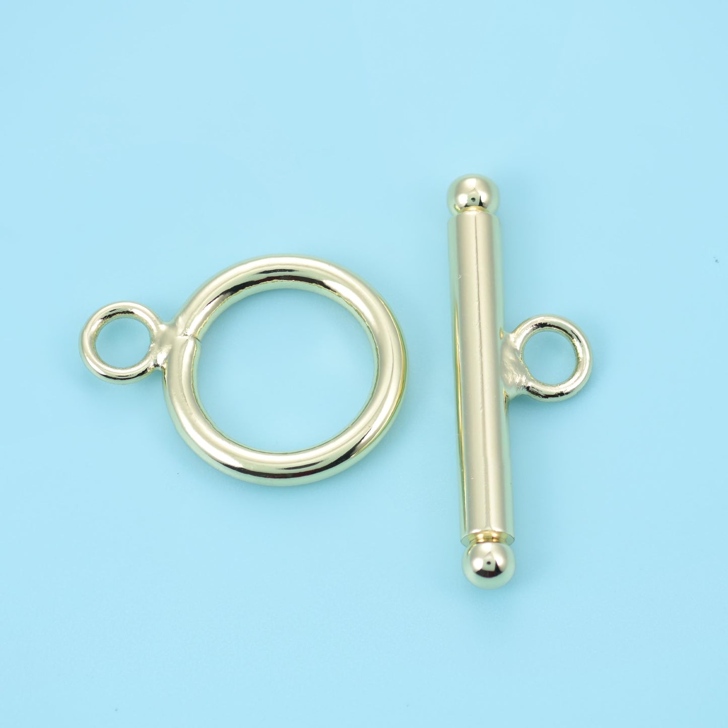 14K Gold Filled Round Toggle Lock Clasp, a smooth ring with a ball-tipped T-bar