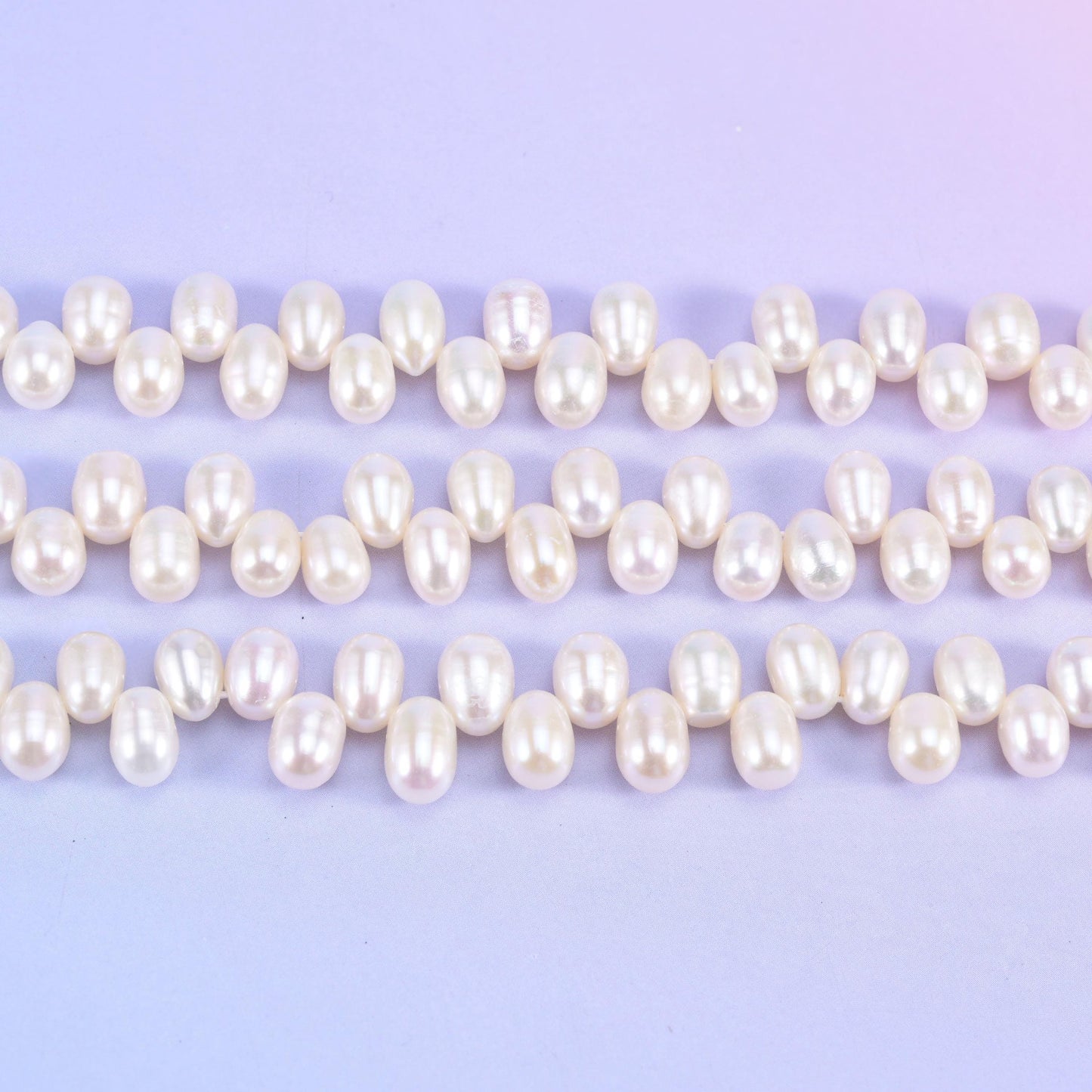 Freshwater pearl rice beads in warm ivory-cream with a deep satin lustre
