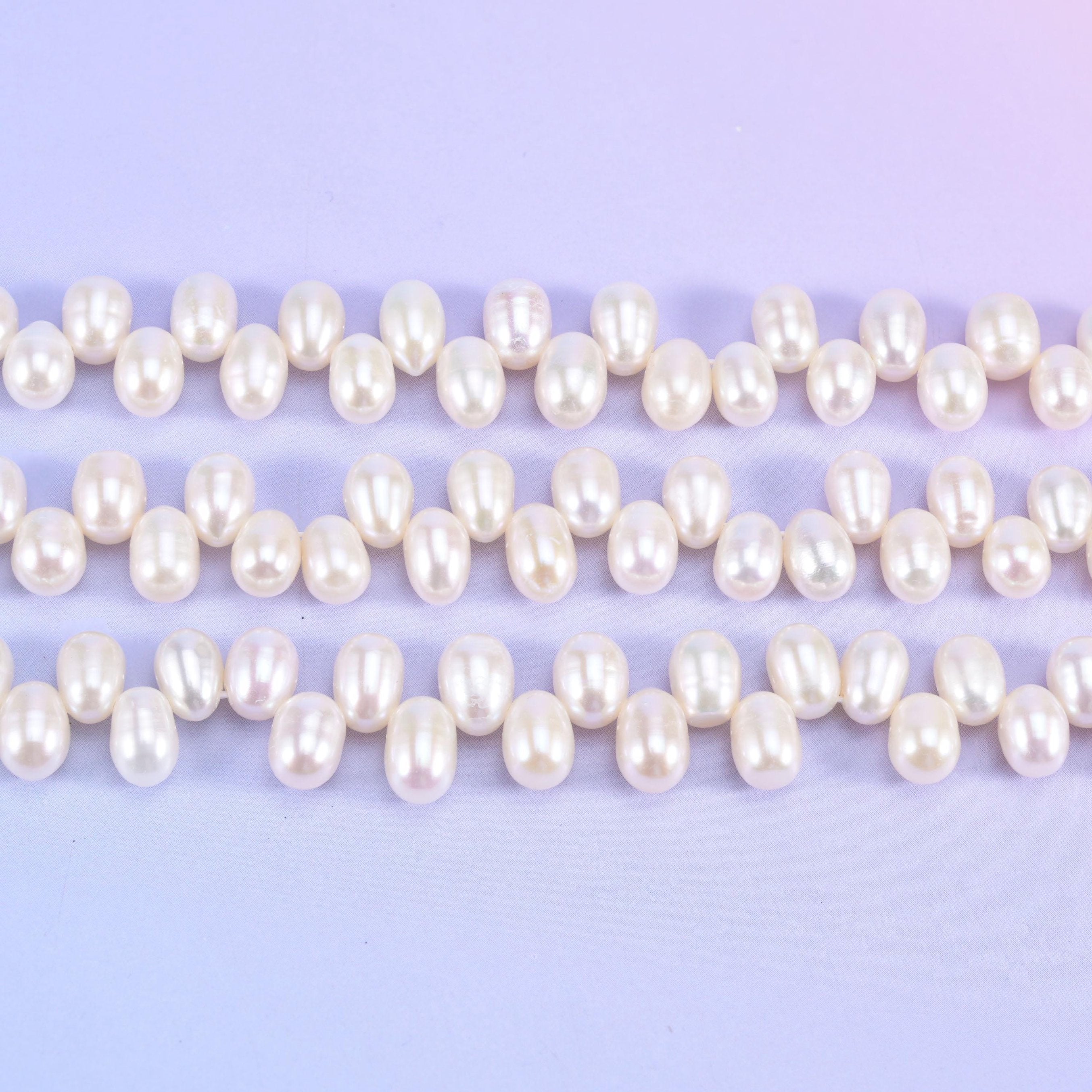 Freshwater pearl rice beads in warm ivory-cream with a deep satin lustre