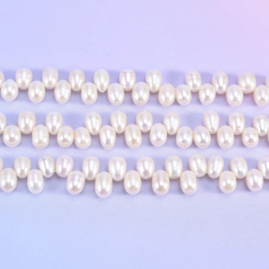 Freshwater pearl rice beads in warm ivory-cream with a deep satin lustre