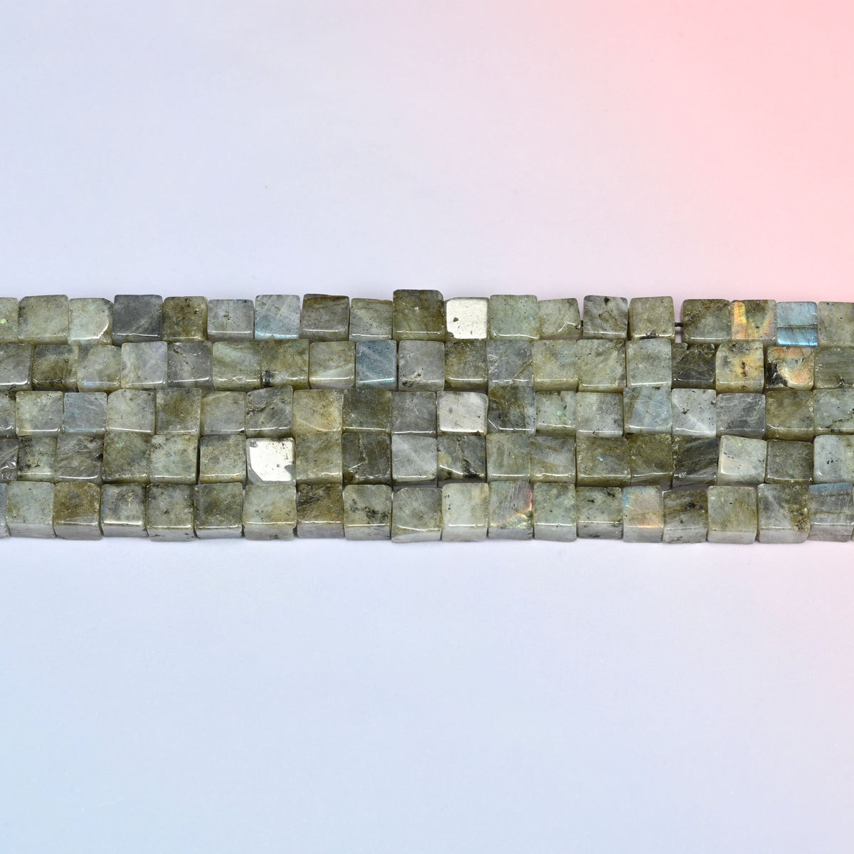 Gray Labradorite cube beads in horizontal rows, the flat polished faces sitting edge to edge