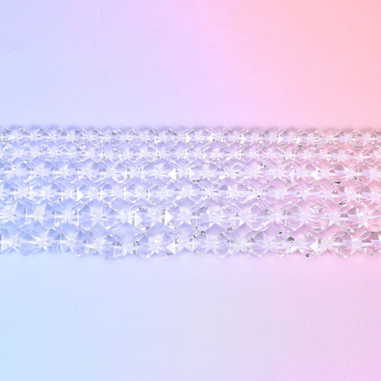Clear Quartz diamond star cut beads laid in rows, faceted rounds in 6mm, 8mm and 10mm