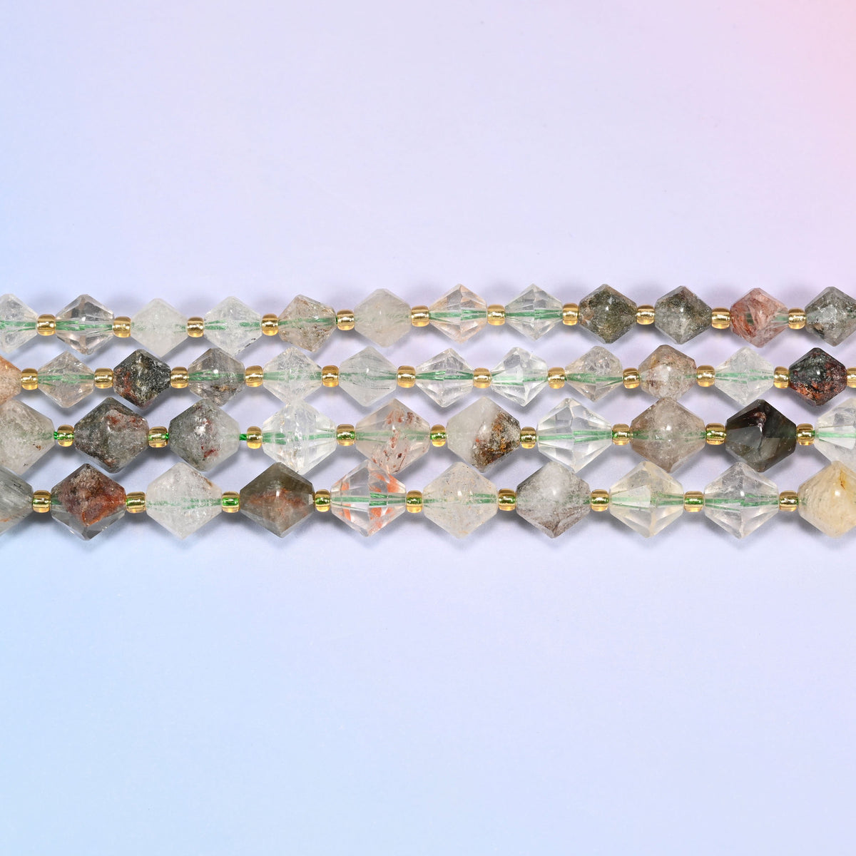 A single straight strand of Green Phantom Quartz faceted bicone beads, 8mm and 10mm, laid flat showing the full 15 inch length.