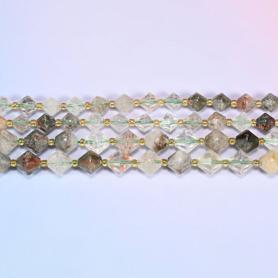 A single straight strand of Green Phantom Quartz faceted bicone beads, 8mm and 10mm, laid flat showing the full 15 inch length.