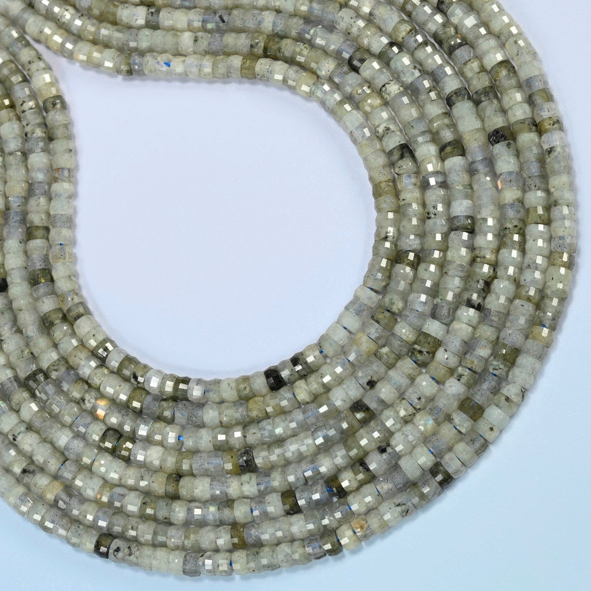 White labradorite faceted heishi disc beads curved into an open loop, light gray-green beads