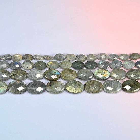 Gray Labradorite faceted oval beads in horizontal rows, the long faceted faces lying flat along each strand