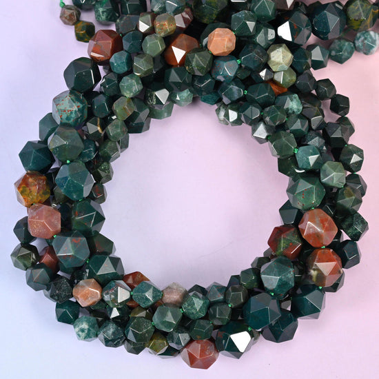 Indian Bloodstone star cut beads coiled in a loop, approximately 38 beads per 10mm strand