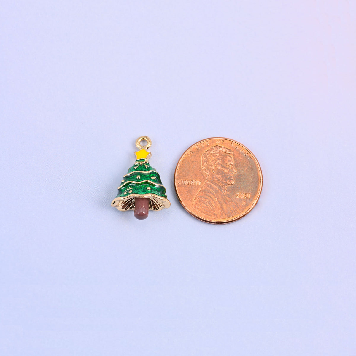 Single christmas tree charm shown for scale at 18.92 x 12.30mm, green enamel over 18K gold plated brass.
