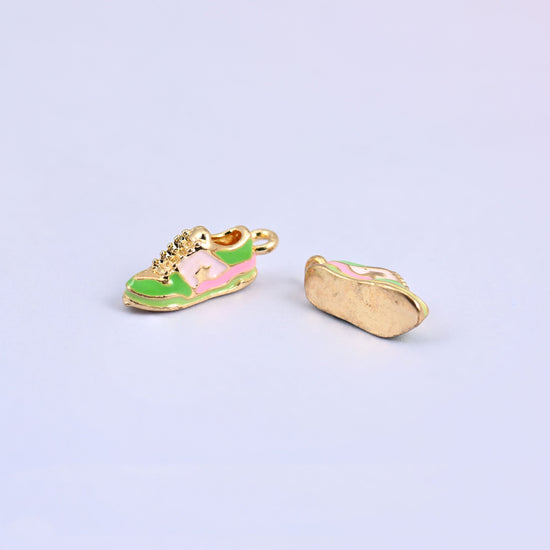 Green sneaker charm next to a second turned over to show the plain gold plated sole.