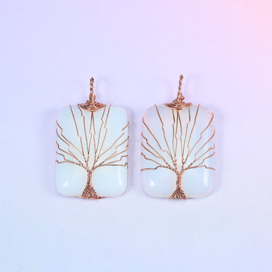 Rectangle Gemstone Tree of Life Pendant in milky white stone, two pieces side by side, the copper branches spread wide across the light surface.
