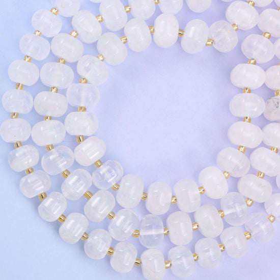 Open loop of pumpkin rondelles on lilac, beads evenly cut and closely matched