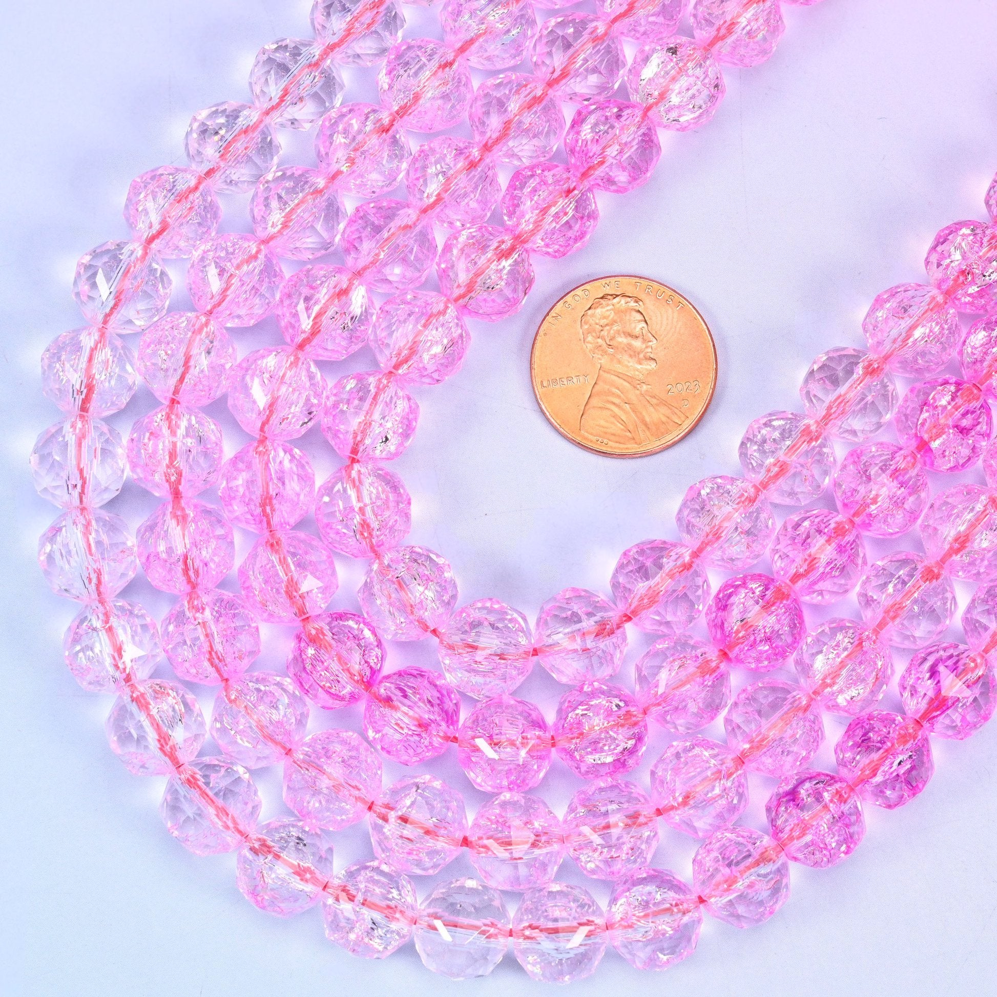Faceted round cut transparent pink glass beads