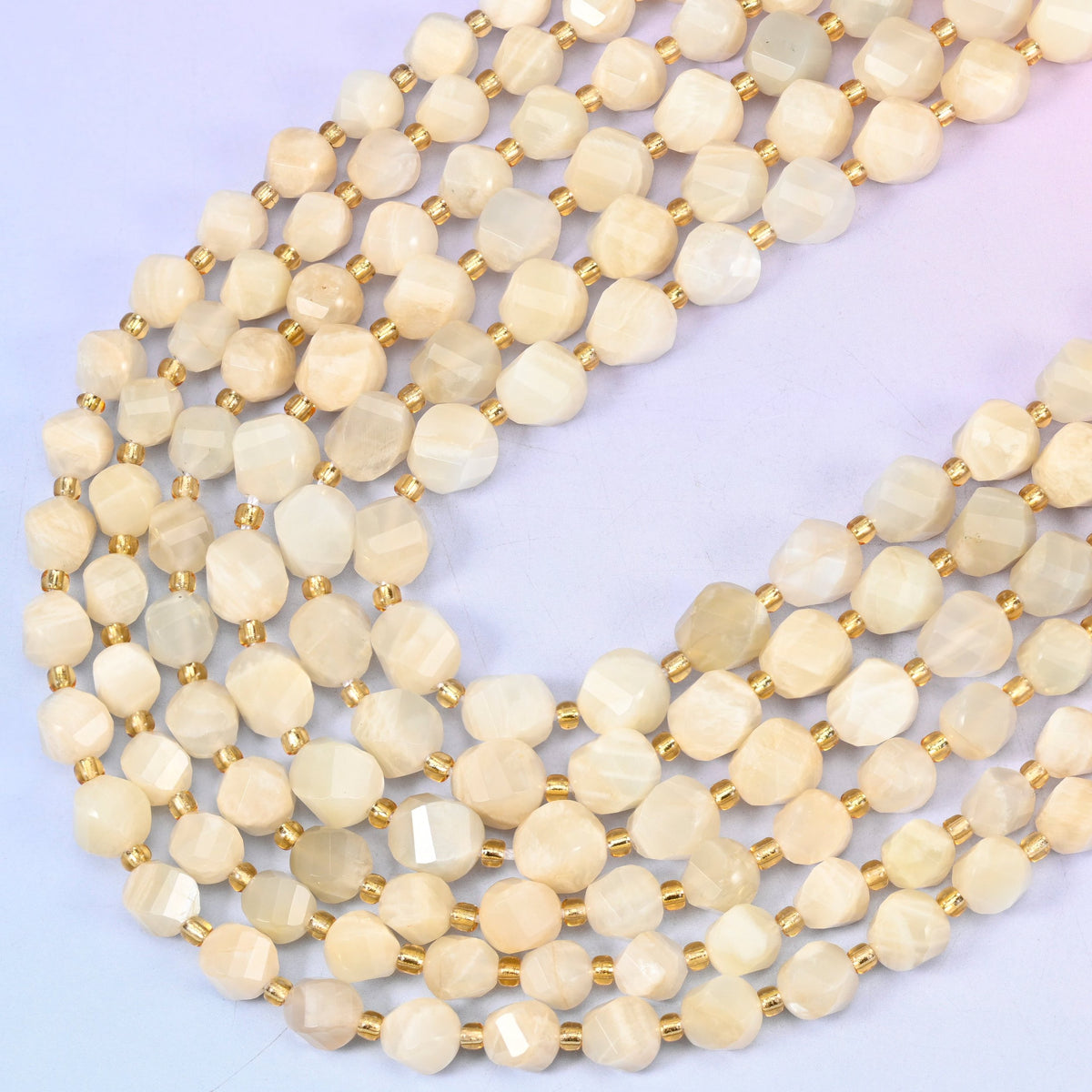White Moonstone faceted spiral twist beads, 15 inch strand
