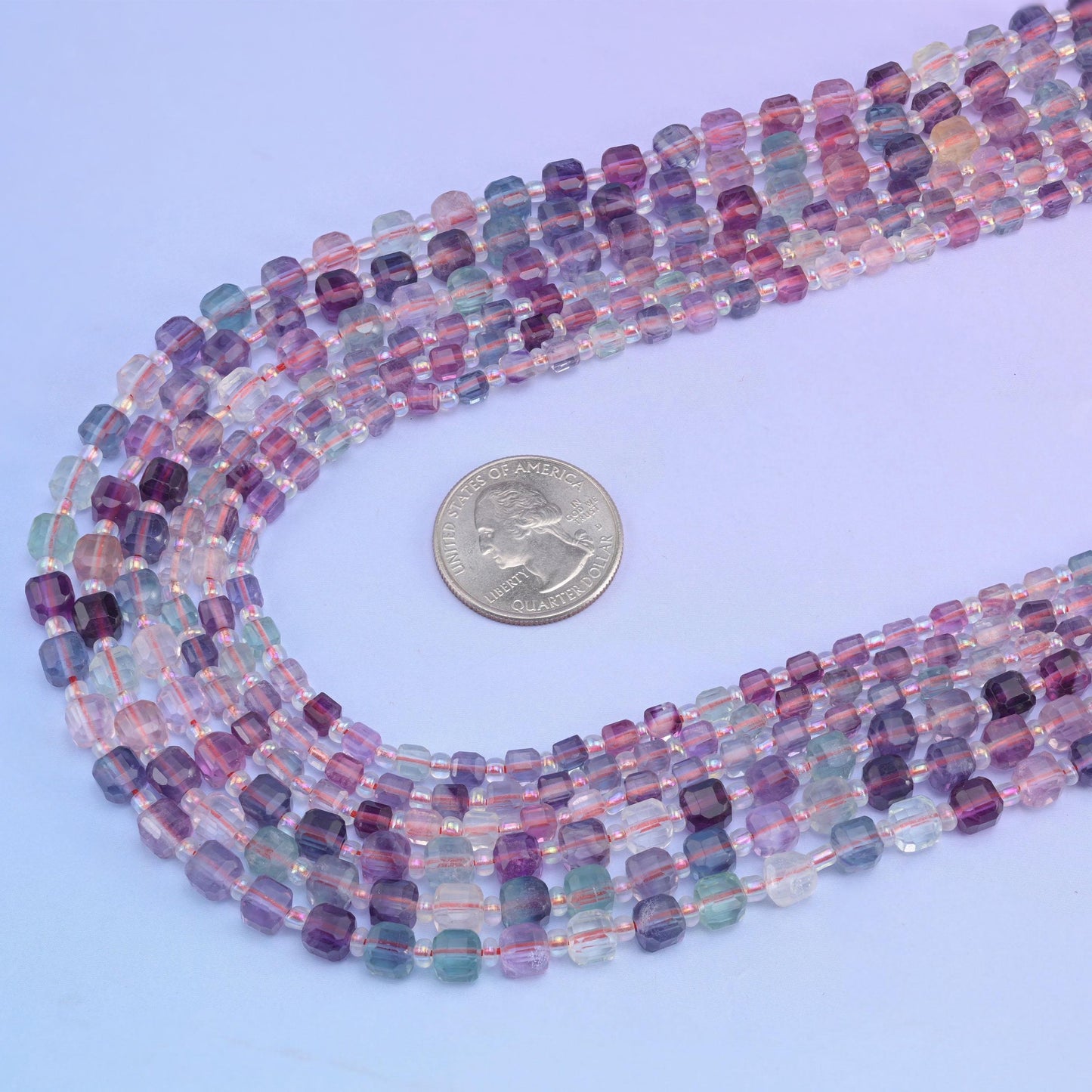 Rainbow Fluorite beads, approximately 47 to 59 per strand.