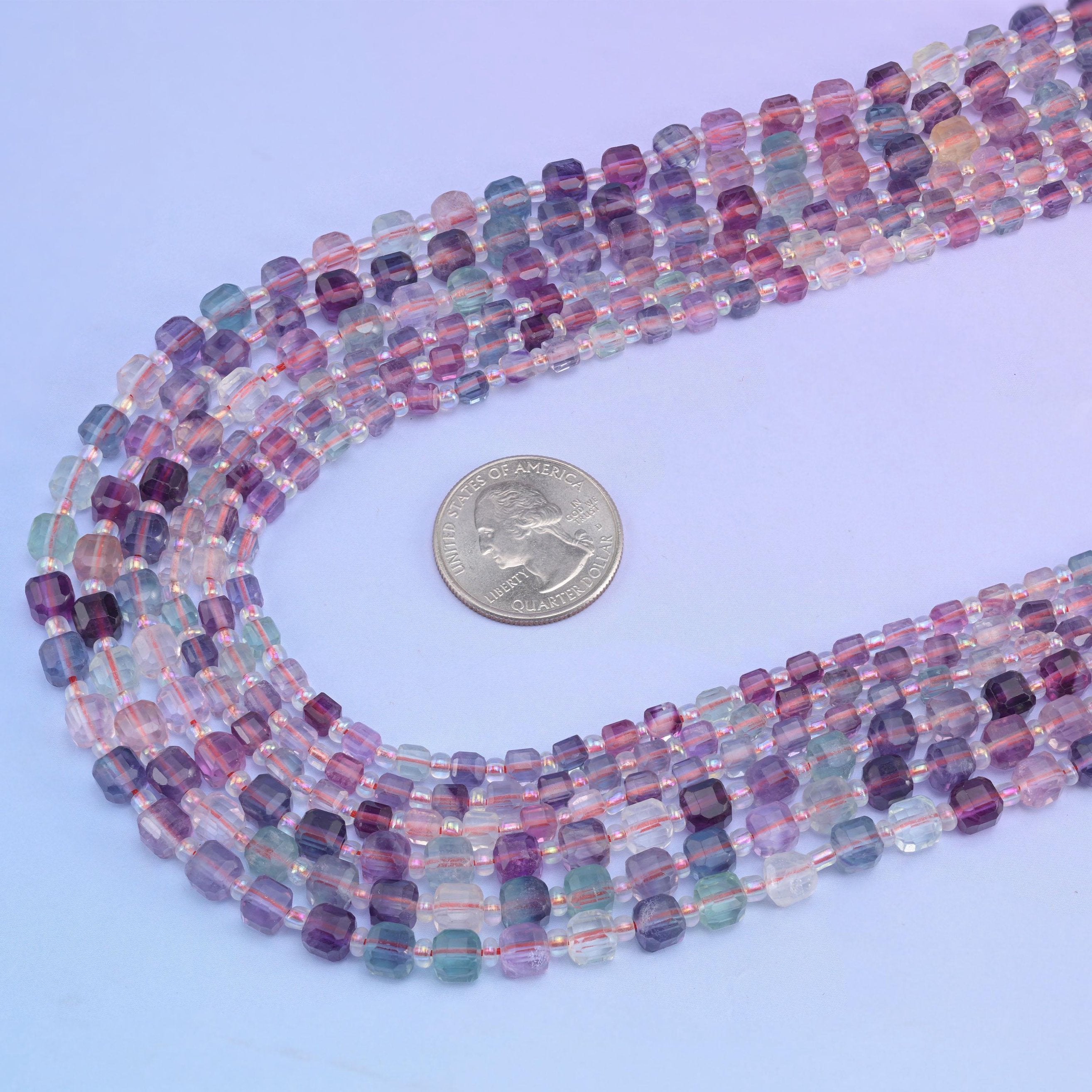 Rainbow Fluorite beads, approximately 47 to 59 per strand.