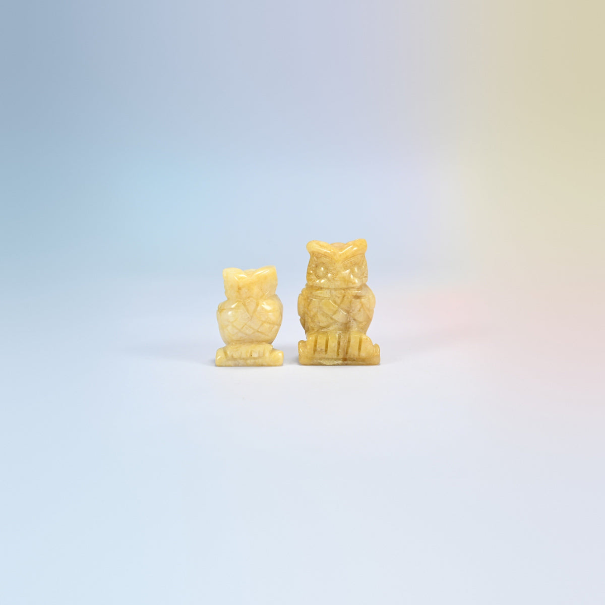 Owl crystal carving in yellow jade, soft yellow natural stone