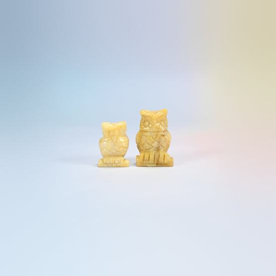 Owl crystal carving in yellow jade, soft yellow natural stone