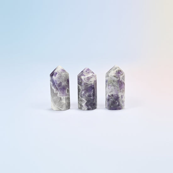 Three natural amethyst small hexagon crystal points, purple and white banded