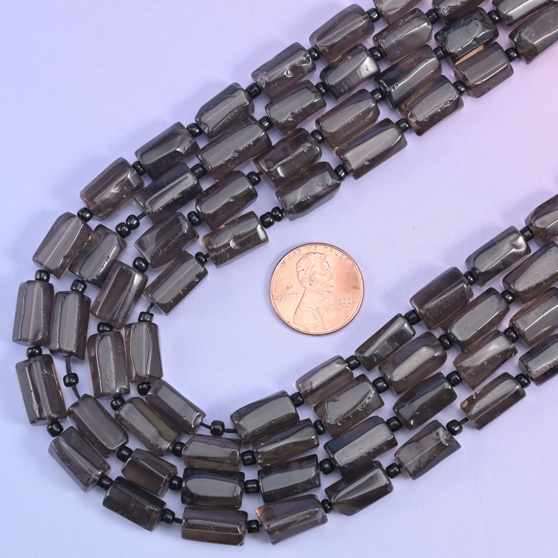 Smoky Quartz faceted tube beads, 15.5 inch strand.