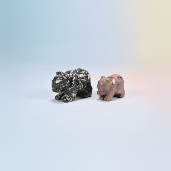 A 2 inch and a 1.5 inch rhodonite bear crystal carving, pink and black natural stone