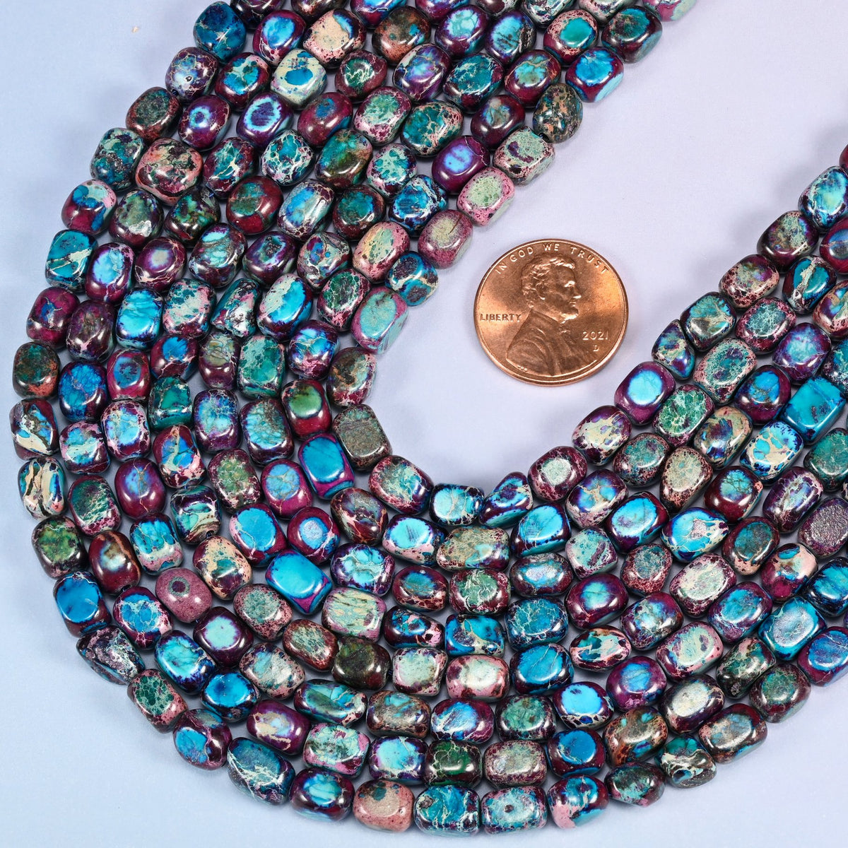 Tumbled nugget cut sea sediment jasper beads, colour-enhanced.