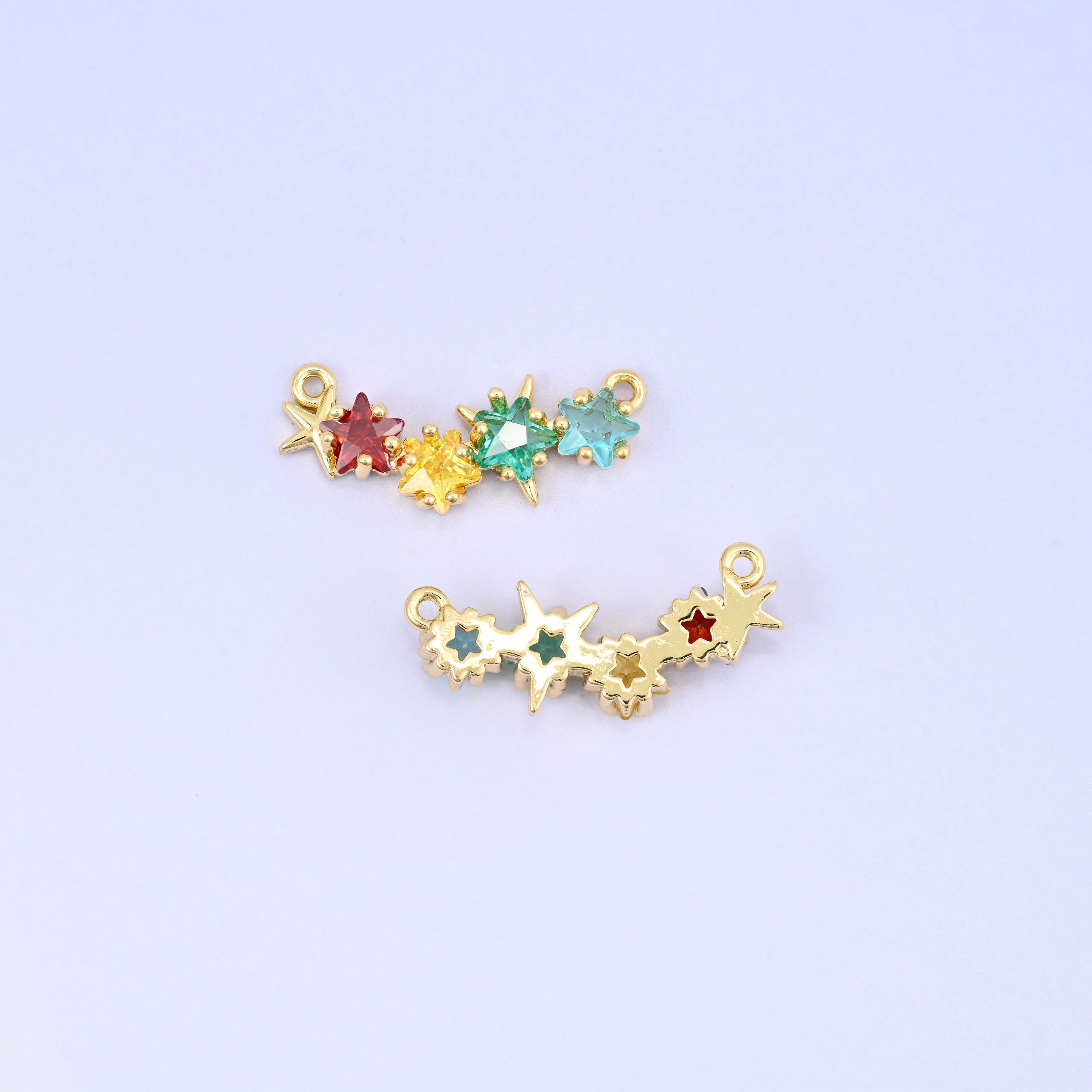 Four star zircon connector pendants in garnet red, lemon yellow, mint green and aqua