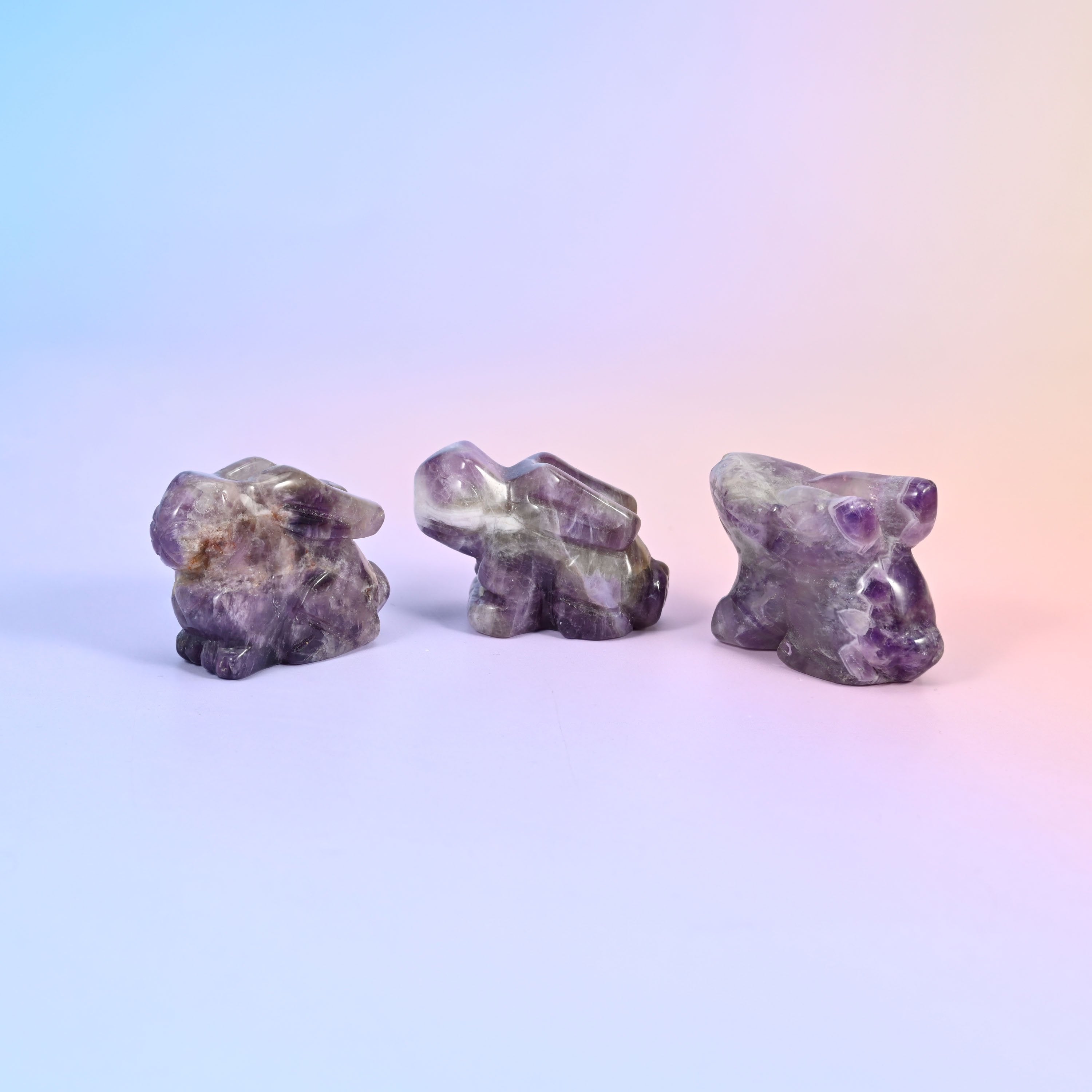 Laying down bunny carving offered in 47 gemstones, from deep green and cream to lilac, coral and blue