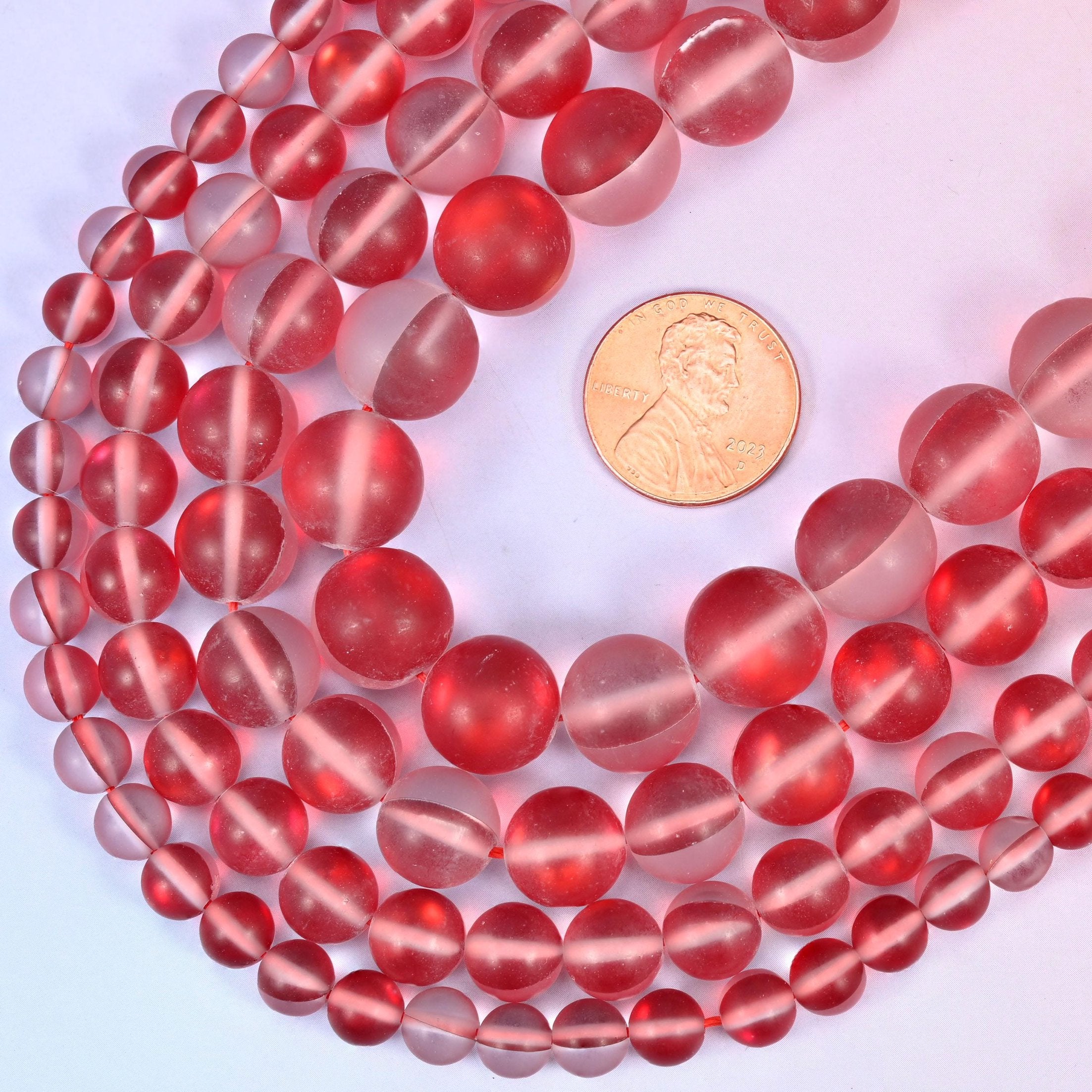 Round matte frosted cherry-red glass beads with iridescent coating