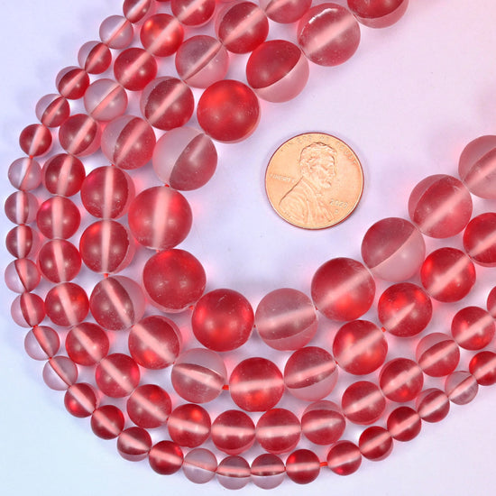 Round matte frosted cherry-red glass beads with iridescent coating