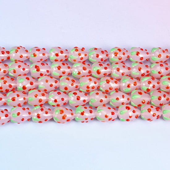 Pink Red Dots Strawberry Glass Beads in milky pink with a pale green leafy crown