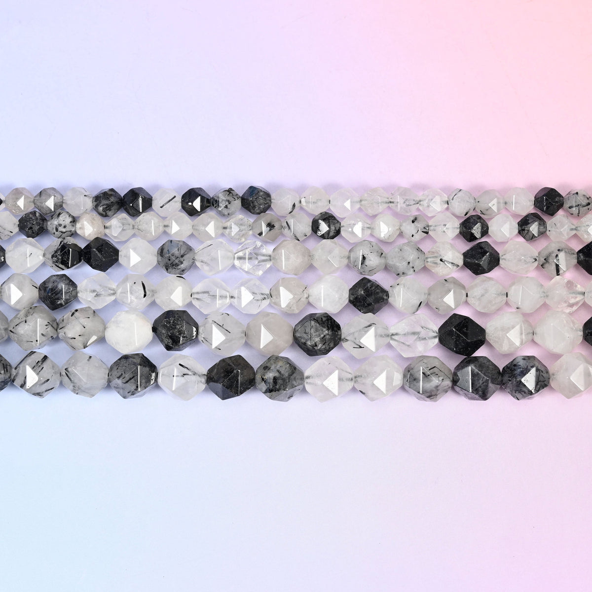 Black Rutilated Quartz threaded with striking black rutile needles.