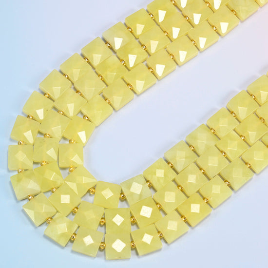 Lemon Jade faceted flat square beads in several strands curved into a wide U, soft light lemon yellow stone
