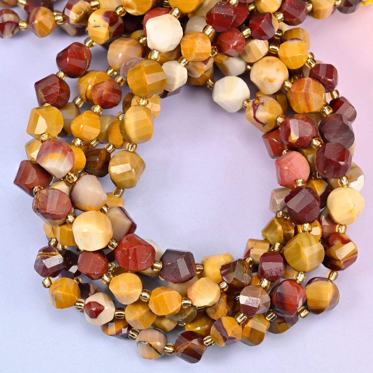 Mookaite faceted spiral twist beads, close view of the coiled strands mixing mustard yellow, brick red and cream