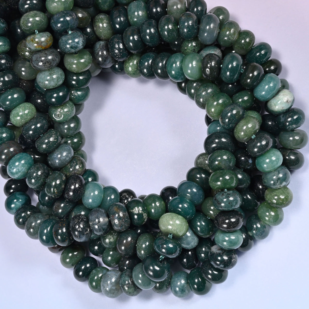 Moss Agate rondelle beads, close view of the coiled strands showing deep green