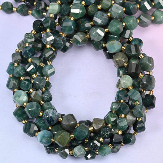 Moss Agate faceted spiral twist beads, close view of the coiled strands showing deep green with translucent white inclusions