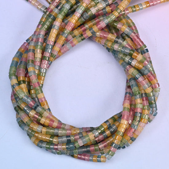 Multicolor Fluorite smooth heishi disc beads, close view of the coiled strands mixing rose pink, amber, sea green and grey