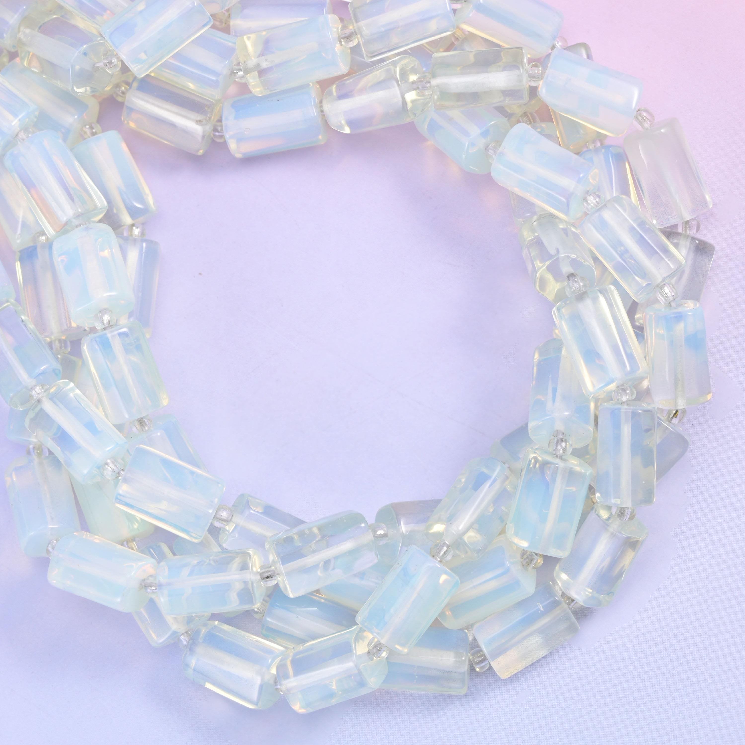 Opalite faceted tube beads coiled into a loop, man-made glass with an opalescent glow.