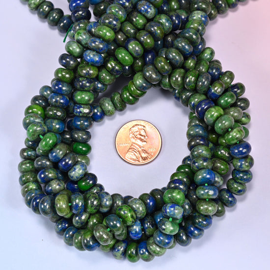 Phoenix Lapis rondelle bead strands coiled around a US penny for size reference