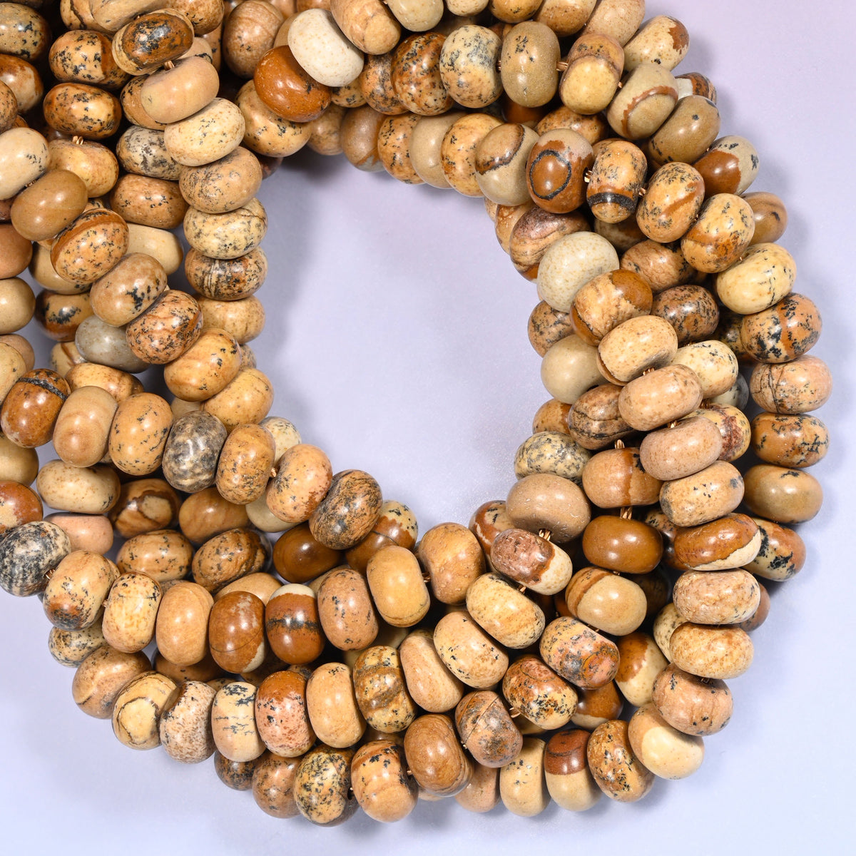 Picture Jasper rondelle beads, close view of the coiled strands showing tan and beige with brown markings