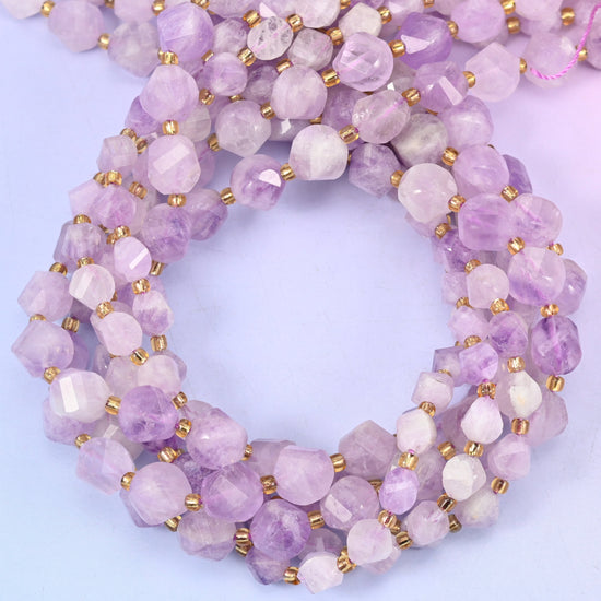Purple Jade faceted spiral twist beads, close view of the coiled strands showing soft lilac with white patches