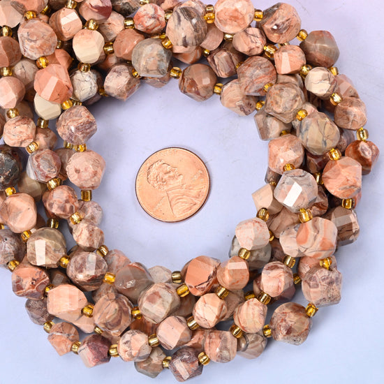 Natural Red Howlite faceted spiral twist bead strands coiled around a US penny for size reference