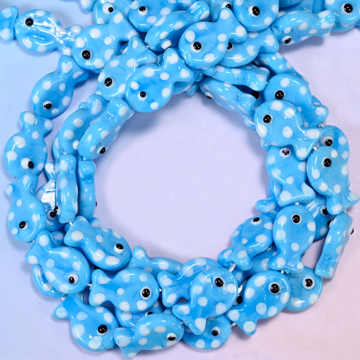 Sky Blue with White Dot Fish glass beads, close view of the coiled strands in sky blue with white spots