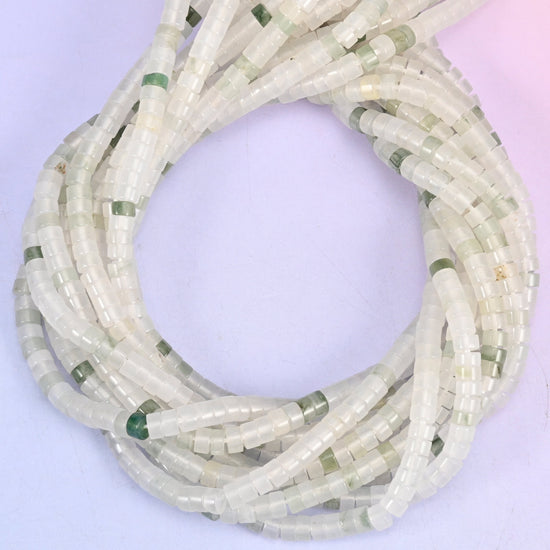 Tianshan Jade smooth heishi disc beads, close view of the coiled strands showing translucent white with occasional green flecks