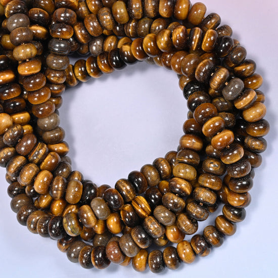 Tiger Eye rondelle beads, close view of the coiled strands showing golden brown chatoyant banding