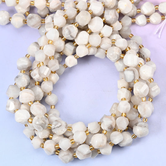 White Crazy Agate faceted spiral twist beads, close view of the coiled strands in white and cream with gold spacer beads
